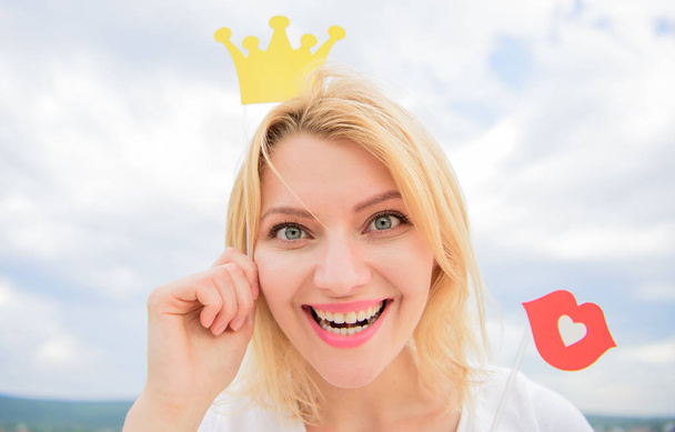 So good to be queen. Lady princess posing cheerful with yellow crown. Woman blonde hair hold cardboard tiara or crown and red lips symbol of love sky background. Dream of every girl to become queen. - Фото, зображення