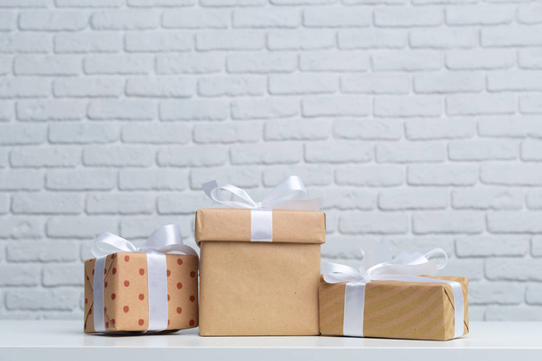 Gift boxes on white table - Zdjęcie, obraz