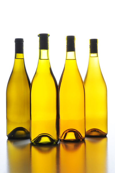 Four Wine Bottles Back Lit - Foto, imagen