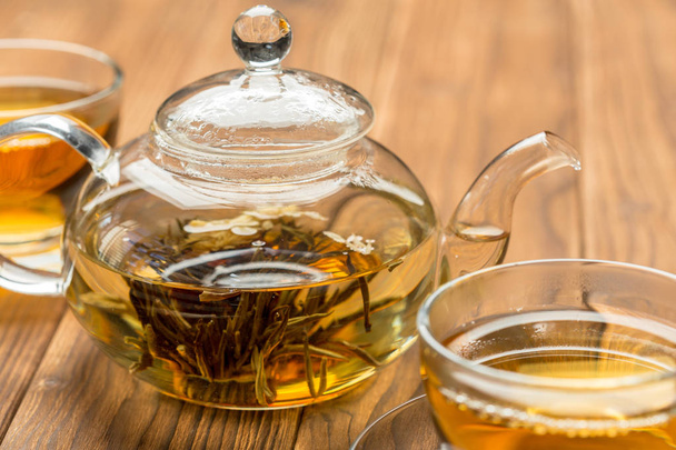 Cups and teapot with herbal tea, top view - Φωτογραφία, εικόνα