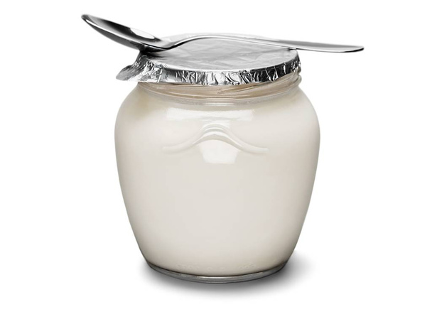Fresh yogurt with spoon on light background - Photo, image