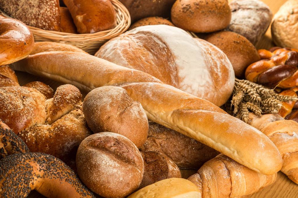 Chléb pekárny, šišky chleba na backgorund - Fotografie, Obrázek