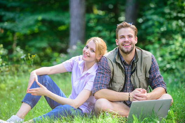 Inspiring environment. Modern technologies give opportunity work in any environment conditions. Man and girl looking for inspiration in nature. Couple youth spend leisure outdoors working with laptop - Foto, Bild