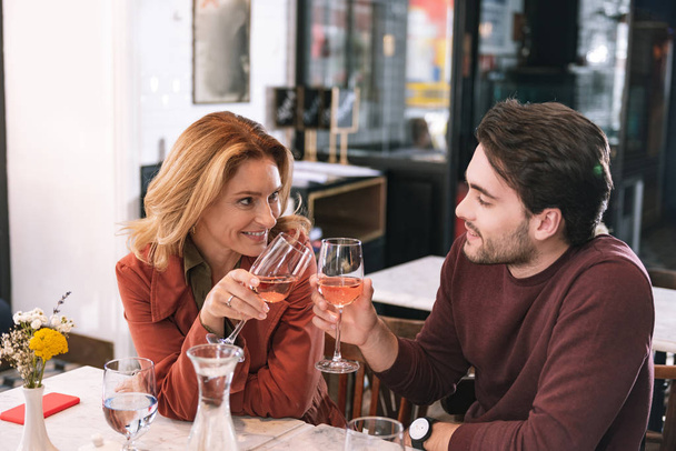 Sincere loving couple enjoying wine - Foto, immagini