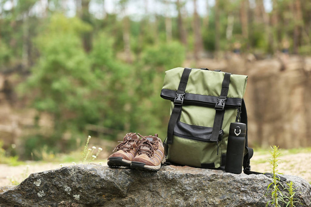 Set of camping equipment on rock outdoors - 写真・画像