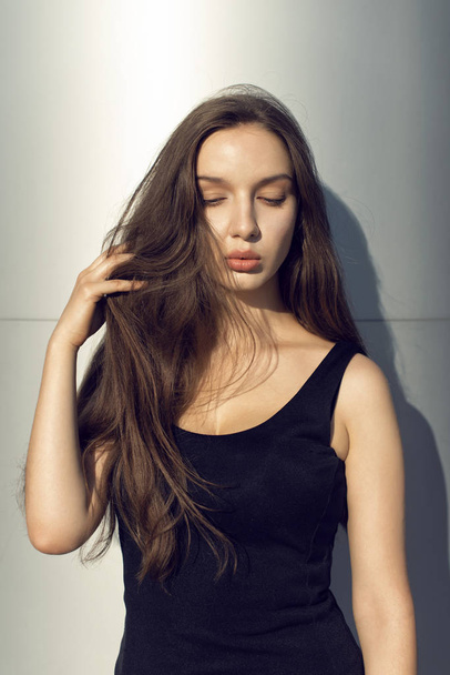 Urban style with long haired brunette - 写真・画像