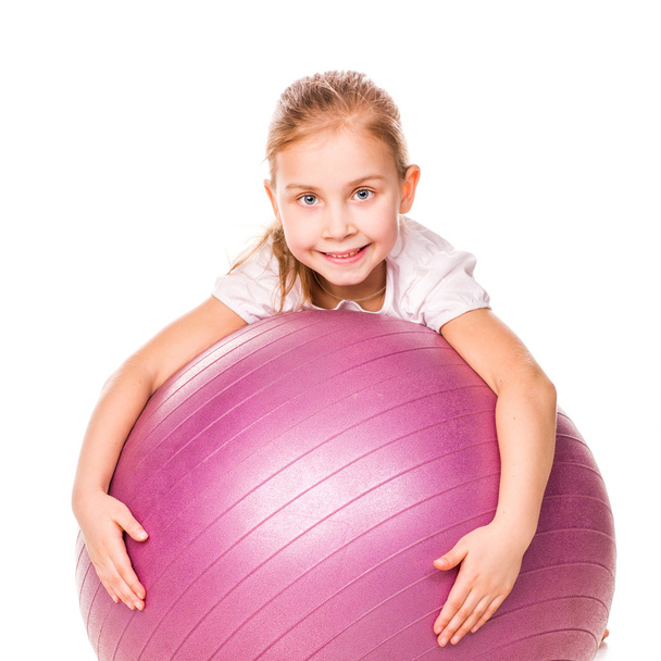 Sportive girl on a fit ball - Foto, afbeelding