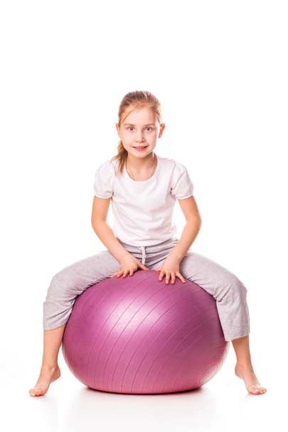 Sportive girl on a fit ball - Foto, afbeelding