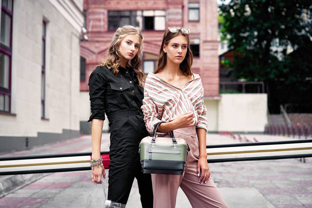 two young attractive fashion models posing - 写真・画像