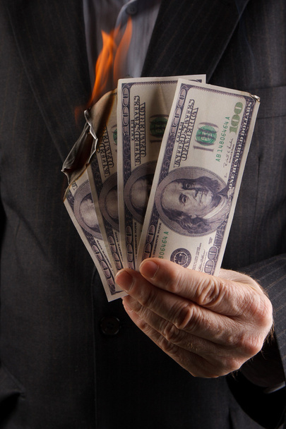 burning dollars in hand - Foto, immagini
