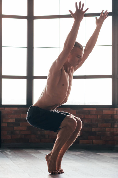 yoga instructor chair pose strong sporty trainer - Zdjęcie, obraz