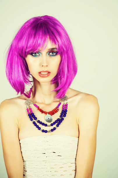 Woman in violet wig with fashionable makeup. - Photo, Image