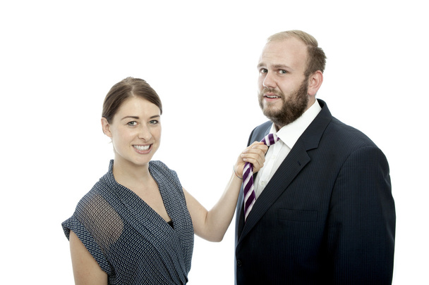 genç esmer kadın ve sakal iş adamı çekme tie - Fotoğraf, Görsel