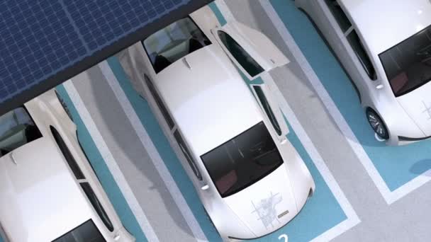 Sähköauto poistuu parkkipaikalta. Parkkipaikalla on aurinkopaneelit, latausasemat ja akut. 3D-mallinnus animaatio
. - Materiaali, video