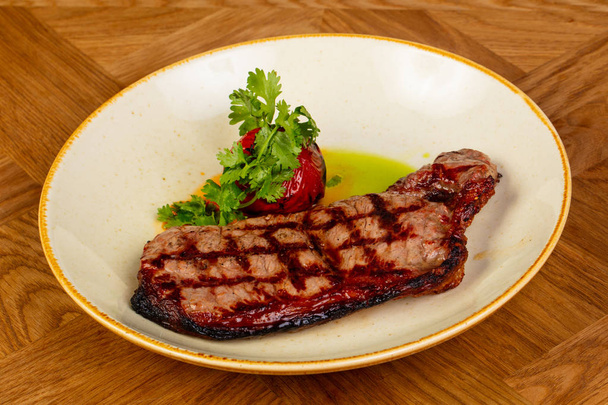 Grilled beef steak with tomato - Fotó, kép