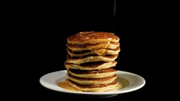 Syrup flows down on a pile of pancakes - Footage, Video