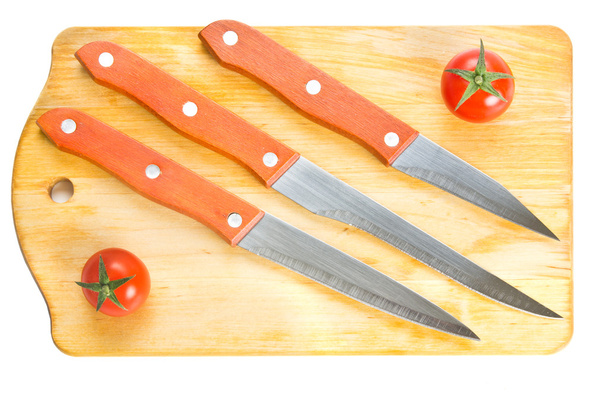 Kitchen knives on chopping board - Photo, image