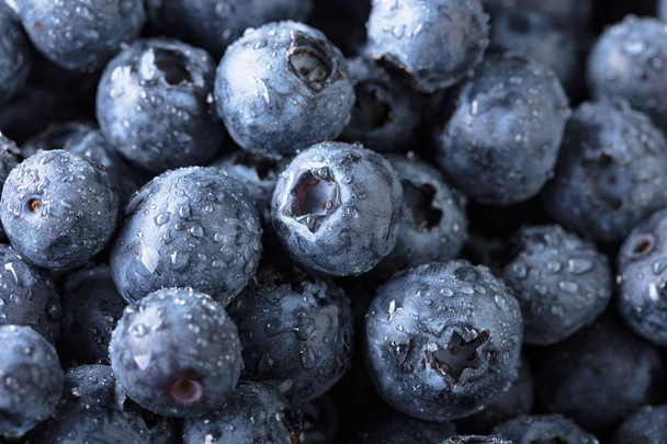  Ripe and juicy fresh picked blueberries closeup. Wet berries , macro shot. - Photo, Image