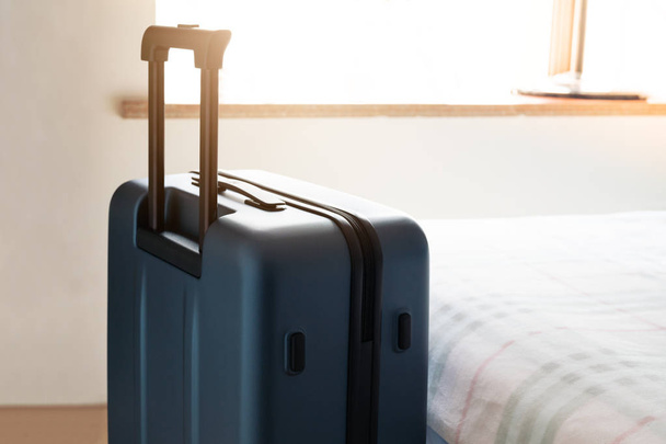 passenger luggage bag in bed room, ready for vacation - Φωτογραφία, εικόνα