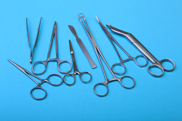 Close Up Surgical instruments and tools on blue mirror background. Selective focus. - Valokuva, kuva