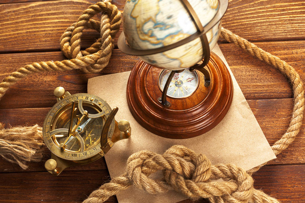 Compass and rope on wooden table - Photo, image
