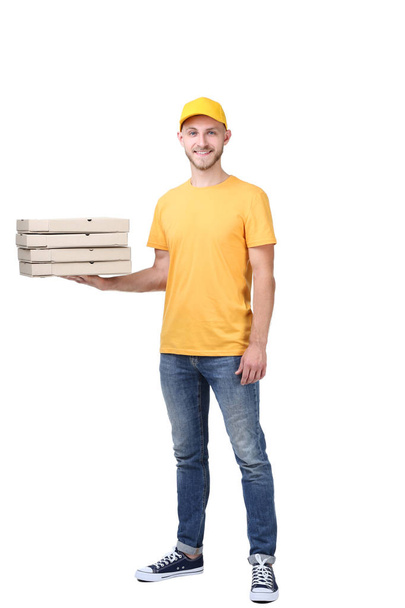Delivery man with holding cardboard boxes with italian pizza isolated on white background - Foto, Imagem