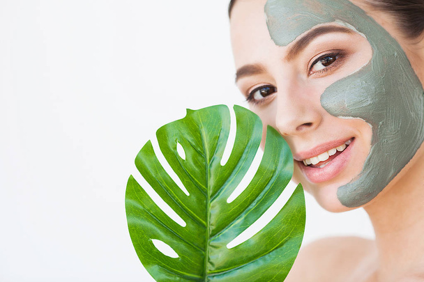 Skincare. Beautiful Woman With Perfect Skin Near Green Leaf Over White Background. - Φωτογραφία, εικόνα
