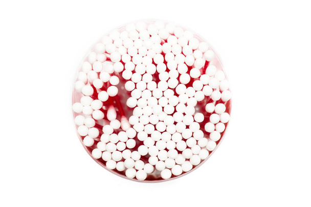Round container with cotton buds on a white background, isolated - Photo, Image
