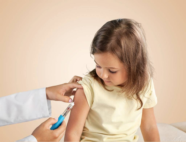 doctor vaccinating little girl - Photo, image