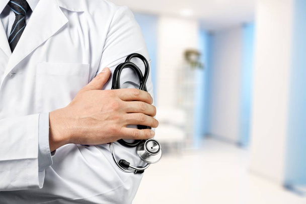 Young man doctor holding stethoscope - Photo, image
