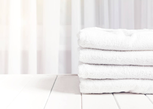 Clean white towels in stack - Фото, изображение