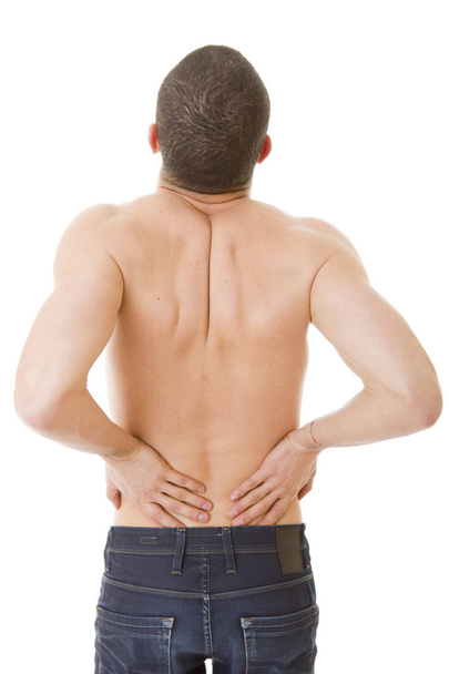 вид сзади молодого человека, держащего спину от боли, изолированного на белом фоне - Фото, изображение