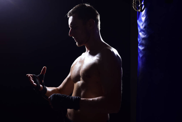 Champion concept. Future champion prepare to fight. Champion boxer wrapping hands up. Champions are made in the ring - Fotografie, Obrázek