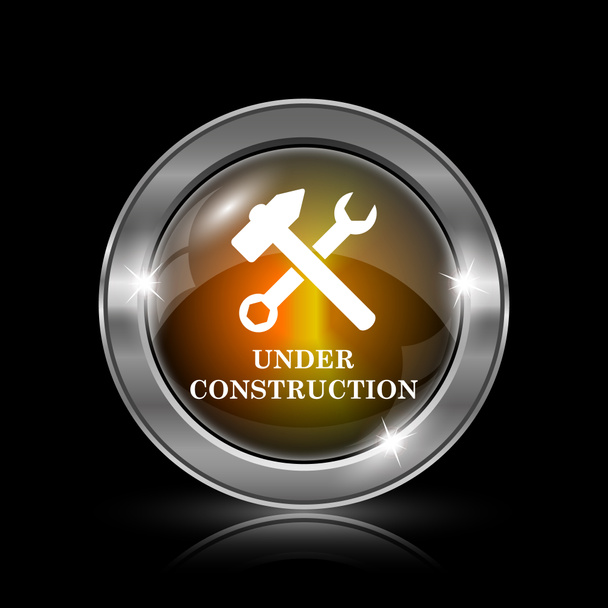 Under construction icon. Metallic internet button on black background - Photo, Image