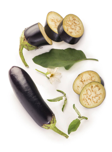 eggplant or aubergine and parsley leaf on white - Фото, изображение