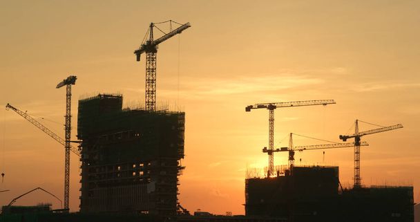 Sunset construction site in city  - Photo, Image