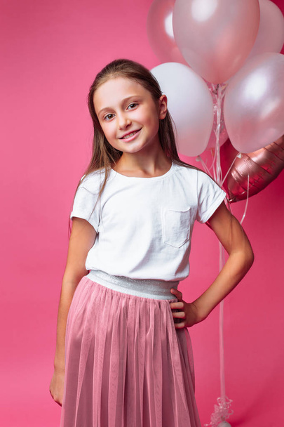 teen girl in beautiful dress on pink background - Foto, Imagem