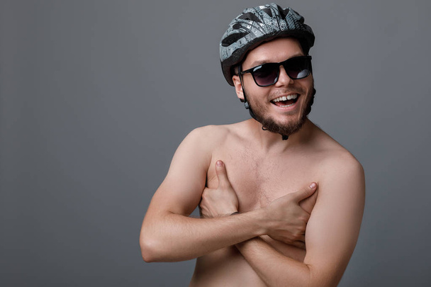 the funny portrait of the young cyclist - Zdjęcie, obraz