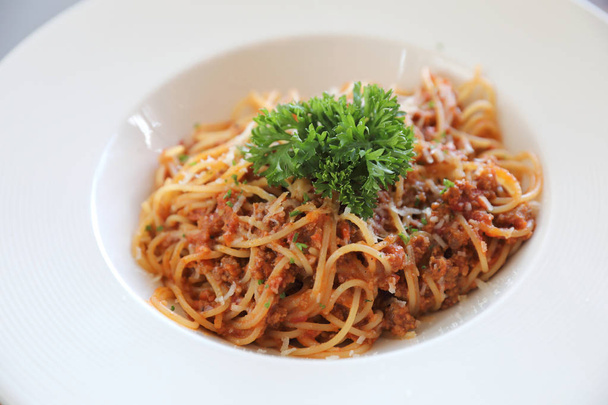 spaghetti Bolognese with minced beef and tomato sauce garnished with parmesan cheese and basil , Italian food - Fotoğraf, Görsel