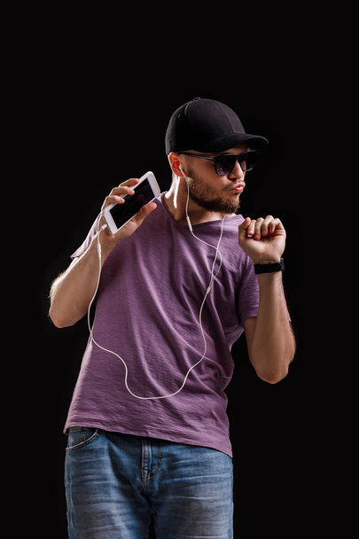 the man listening to music in headphones - Fotó, kép
