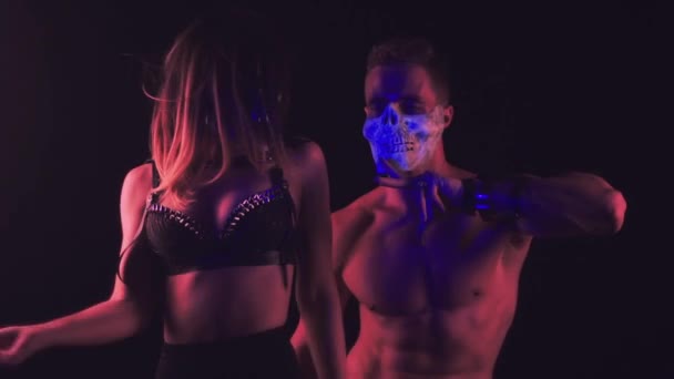 Man and woman dancing in skull masks - Footage, Video