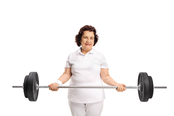 Elderly woman with a barbell isolated on white background - Foto, immagini