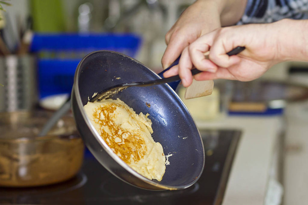 Making homemade pancakes in a kitchen - Fotó, kép