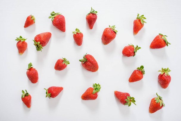 Fresh strawberry. Strawberries on white concrete background. Harvest of organic local strawberries. - 写真・画像