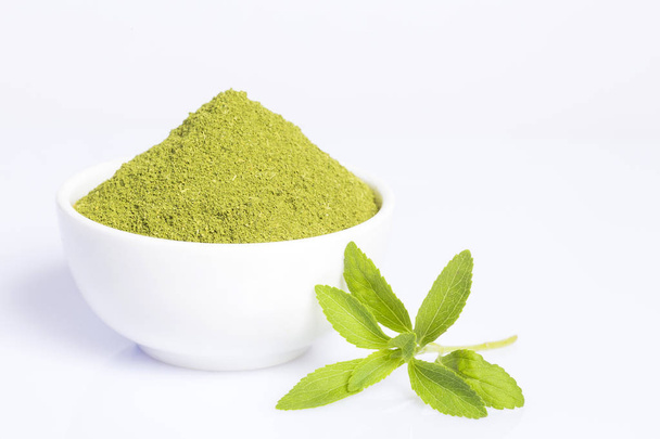 Fresh green Stevia herb and extract powder - Stevia rebaudiana. white background - Foto, afbeelding