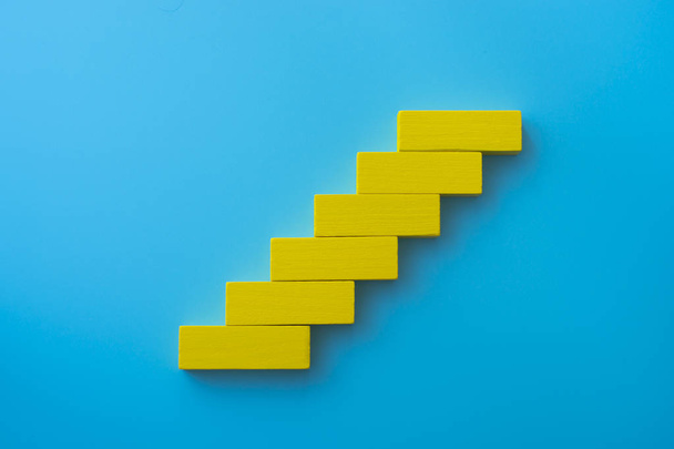 Colorful wood block stacking as step stair. Business concept for growth success process. - 写真・画像