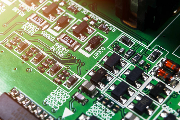 Macro shot of a Circuitboard with resistors microchips and electronic components. Computer hardware technology. Integrated communication processor. Information engineering. Semiconductor. PCB. Closeup - Foto, Imagen