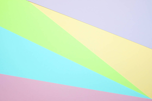 Divatos pasztell színű papír sík feküdt, felülnézet, geometriai háttér textúra, rózsaszín, lila, sárga, bézs, zöld és kék szín. - Fotó, kép