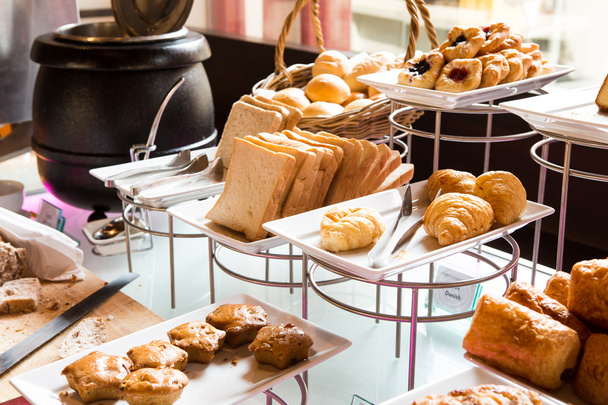 Assortment of fresh pastry on table in buffet - Valokuva, kuva