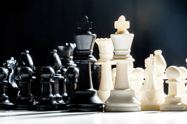 chess pieces on a black background - Фото, зображення
